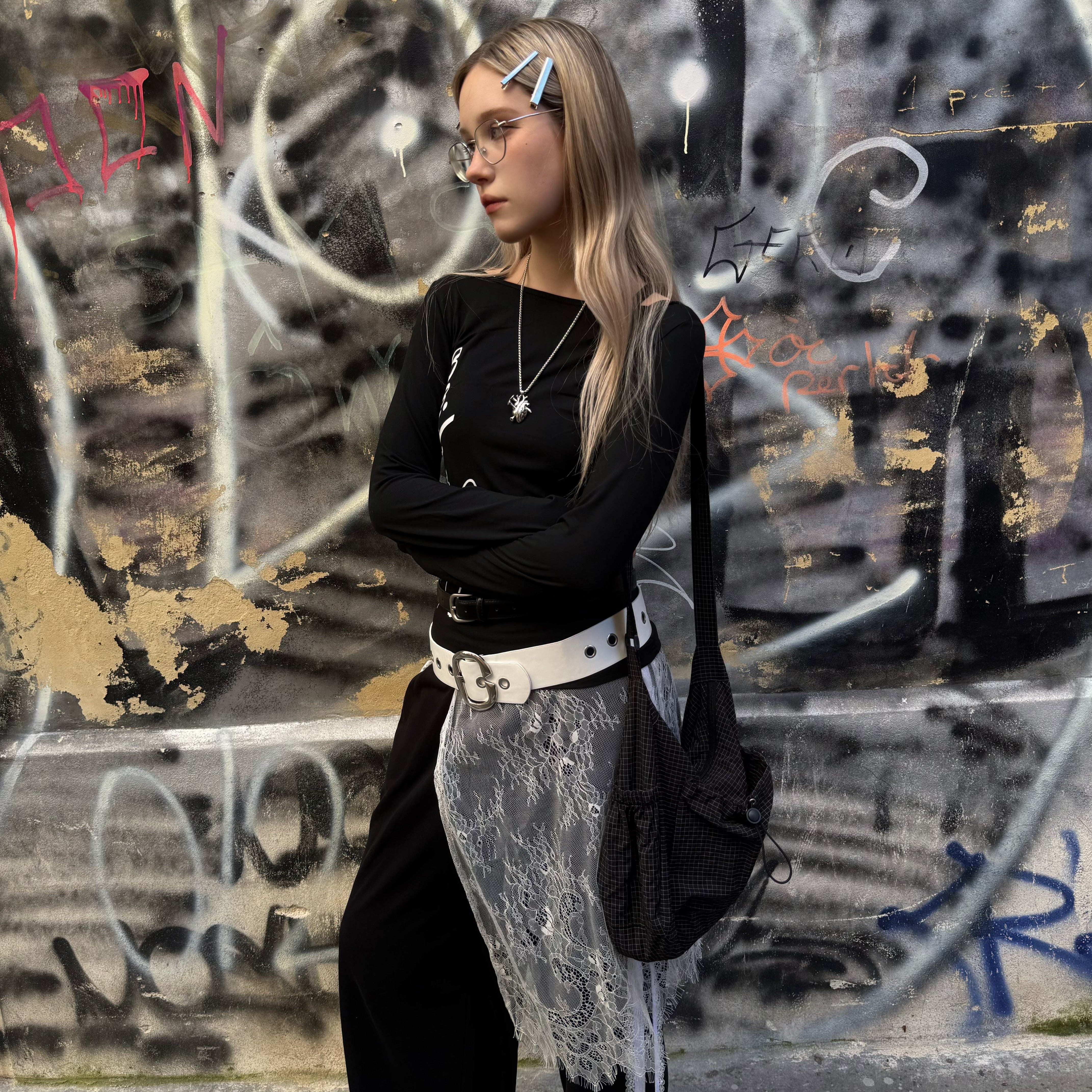 ByNyla Romy bag worn over the shoulder against a graffiti wall